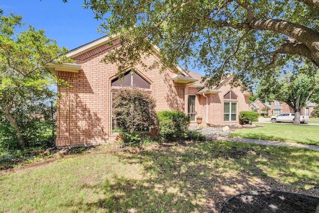 1107 Shoreview Dr, Ennis, TX 75119 - view of front of property with brick siding and a front yard