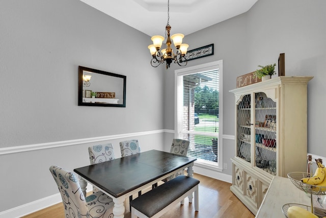 1107 Shoreview Dr, Ennis, TX 75119 - dining room featuring a chandelier, light wood finished floors, and baseboards