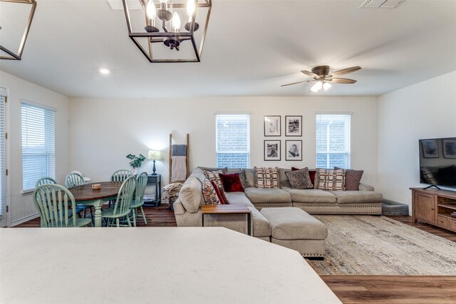8744 Sleepy Daisy Dr, Fort Worth, TX 76131 - living area featuring wood finished floors, ceiling fan, a chandelier, and recessed lighting