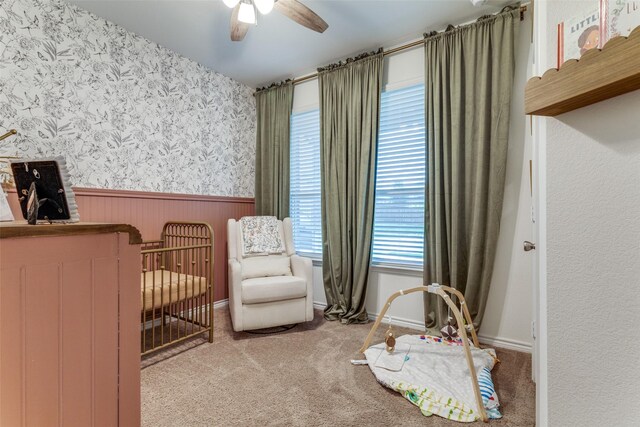 8744 Sleepy Daisy Dr, Fort Worth, TX 76131 - bedroom featuring a wainscoted wall, wallpapered walls, carpet floors, and ceiling fan