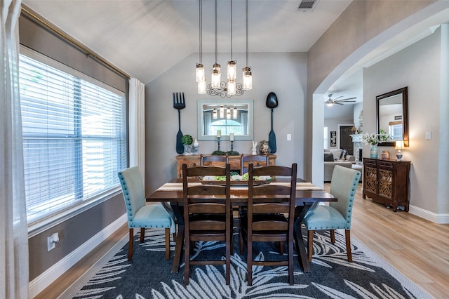 1719 Wheatberry Ln, Allen, TX 75002 - dining area featuring arched walkways, plenty of natural light, a ceiling fan, wood finished floors, and vaulted ceiling