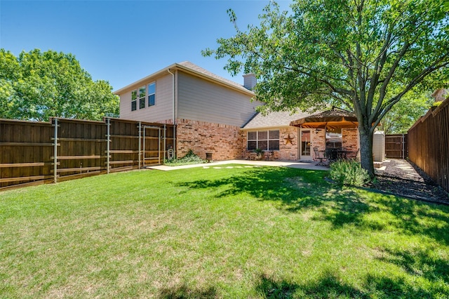 1719 Wheatberry Ln, Allen, TX 75002 - rear view of house featuring brick siding, a chimney, and a patio
