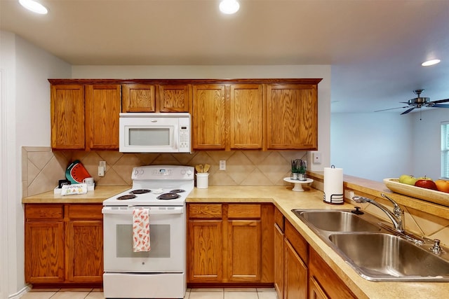 637 Stirrup Bar Dr, Fort Worth, TX 76179 - kitchen with white appliances, a sink, decorative backsplash, a ceiling fan, and recessed lighting