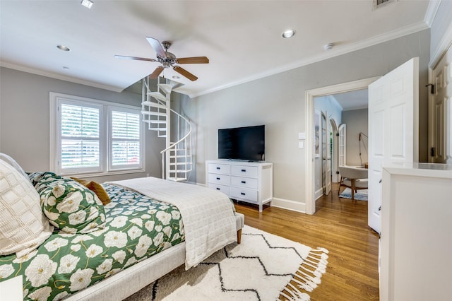 5447 Mccommas Blvd, Dallas, TX 75206 - bedroom with crown molding, wood finished floors, baseboards, recessed lighting, and ceiling fan