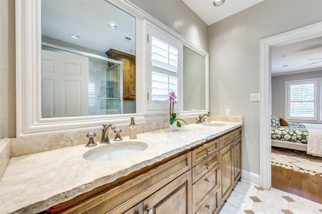 5447 Mccommas Blvd, Dallas, TX 75206 - full bathroom with double vanity, a shower stall, tile patterned floors, ensuite bathroom, and recessed lighting