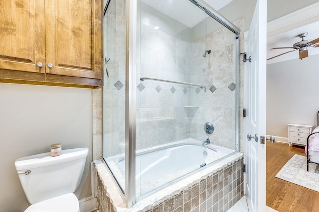 5447 Mccommas Blvd, Dallas, TX 75206 - bathroom featuring a ceiling fan, tiled shower / bath combo, wood finished floors, and toilet
