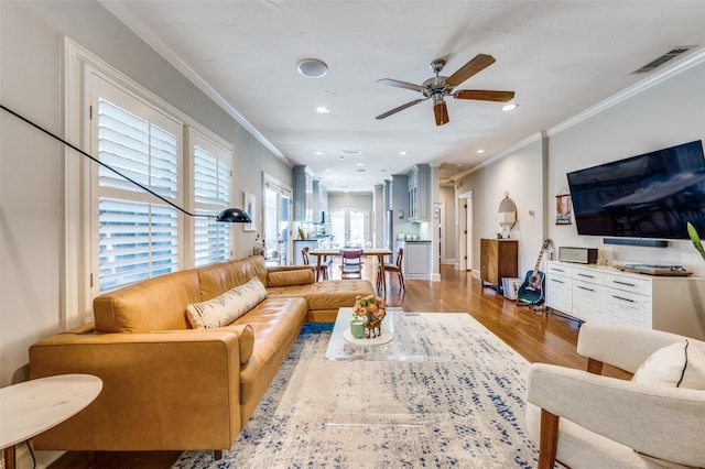 5447 Mccommas Blvd, Dallas, TX 75206 - living area with ceiling fan, ornamental molding, wood finished floors, and recessed lighting