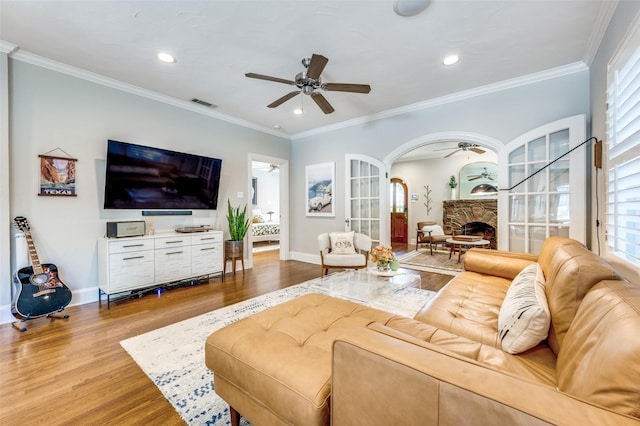 5447 Mccommas Blvd, Dallas, TX 75206 - living area featuring ceiling fan, wood finished floors, plenty of natural light, a stone fireplace, and recessed lighting