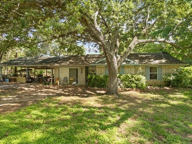 102 Ford Cir, Gun Barrel City, TX 75156 - single story home with driveway, a front yard, and brick siding