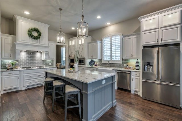 2749 Casa Grande Way, Celina, TX 75009 - kitchen with stainless steel appliances, a sink, white cabinets, and recessed lighting