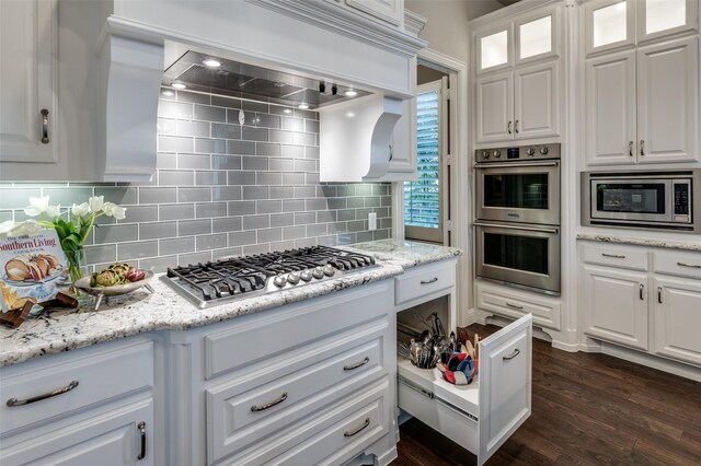 2749 Casa Grande Way, Celina, TX 75009 - kitchen featuring stainless steel appliances, white cabinetry, and backsplash