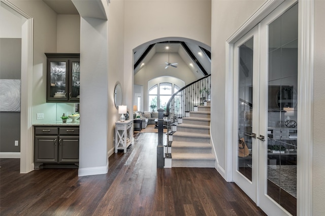 2749 Casa Grande Way, Celina, TX 75009 - foyer entrance featuring dark wood finished floors, ceiling fan, stairway, high vaulted ceiling, and baseboards
