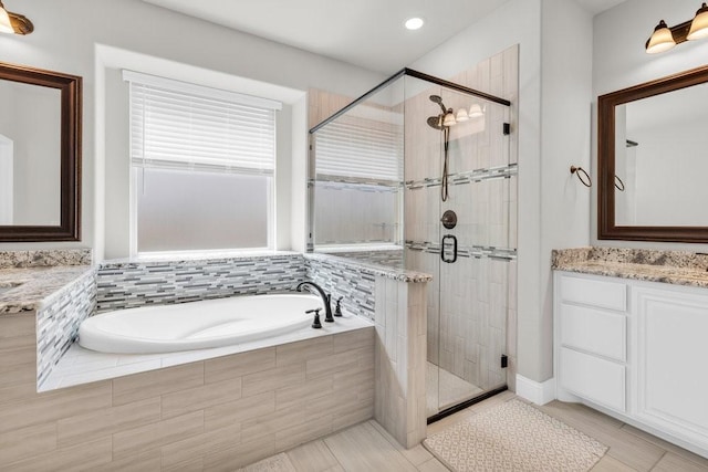 914 Park Vista Dr, Justin, TX 76247 - bathroom with a shower stall, a bath, and vanity