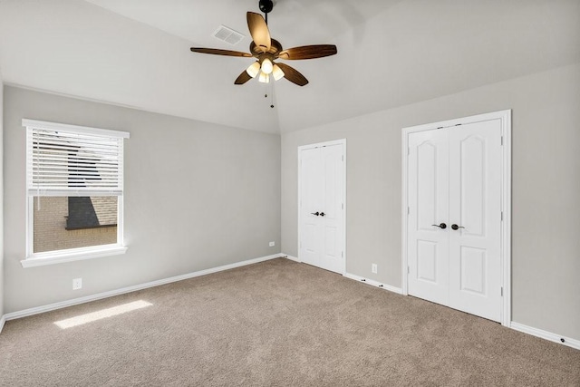 914 Park Vista Dr, Justin, TX 76247 - unfurnished bedroom featuring carpet, baseboards, multiple closets, and a ceiling fan