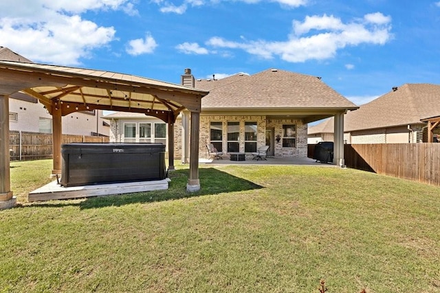 914 Park Vista Dr, Justin, TX 76247 - rear view of property featuring a hot tub, a patio area, a gazebo, and a chimney