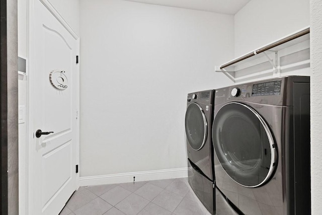 914 Park Vista Dr, Justin, TX 76247 - laundry room with baseboards, washing machine and dryer, and tile patterned flooring