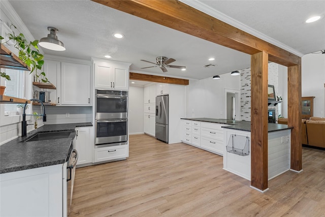 173 Cedar Ridge Dr, China Spring, TX 76633 - kitchen with a sink, stainless steel appliances, ceiling fan, dark countertops, and recessed lighting