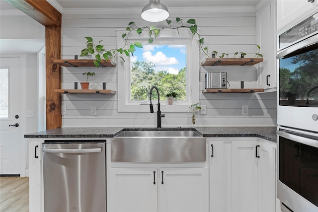 173 Cedar Ridge Dr, China Spring, TX 76633 - kitchen with open shelves, stainless steel appliances, a sink, dark stone counters, and crown molding