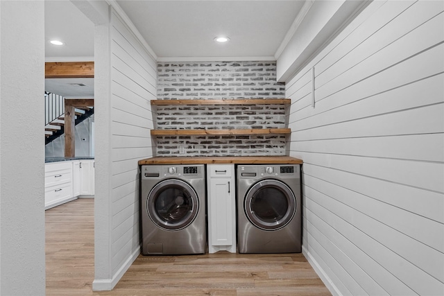 173 Cedar Ridge Dr, China Spring, TX 76633 - laundry area with independent washer and dryer, light wood-style flooring, recessed lighting, wooden walls, and crown molding