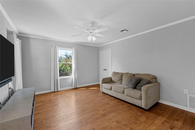 173 Cedar Ridge Dr, China Spring, TX 76633 - living room featuring baseboards, a ceiling fan, ornamental molding, and wood finished floors