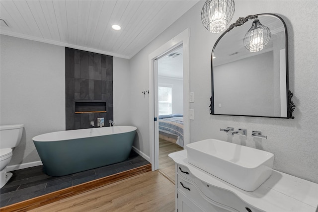 173 Cedar Ridge Dr, China Spring, TX 76633 - ensuite bathroom featuring wood finished floors, toilet, ornamental molding, a soaking tub, and wooden ceiling