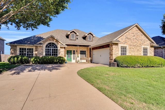 114 Winters Edge Dr, Red Oak, TX 75154 - view of front of property featuring brick siding, an attached garage, concrete driveway, and a shingled roof