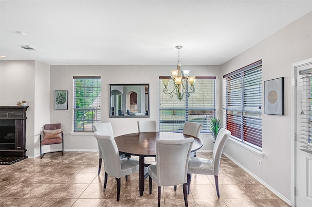 4518 Park Meadow Ct, Garland, TX 75043 - dining room featuring a chandelier, light tile patterned floors, and baseboards