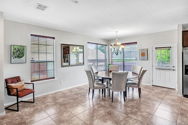 4518 Park Meadow Ct, Garland, TX 75043 - dining space with a chandelier, baseboards, and light tile patterned floors