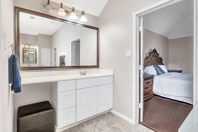 4518 Park Meadow Ct, Garland, TX 75043 - bathroom featuring vaulted ceiling, connected bathroom, vanity, baseboards, and marble finish floors