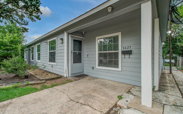 6625 Corbin St, Houston, TX 77055 - doorway to property featuring a patio area and a security system