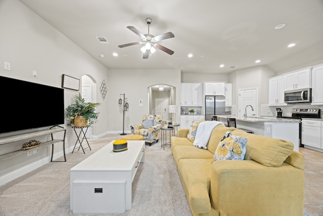 1404 Eagle Nest Dr, Azle, TX 76020 - living area featuring arched walkways, recessed lighting, a ceiling fan, and baseboards