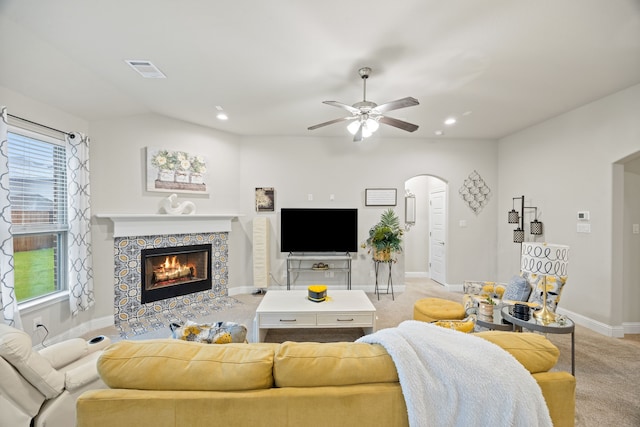 1404 Eagle Nest Dr, Azle, TX 76020 - living area with arched walkways, a ceiling fan, a fireplace, baseboards, and healthy amount of natural light