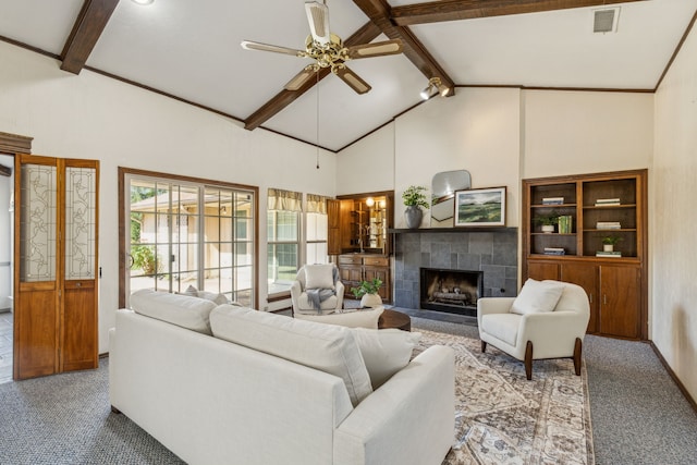 3109 Bullock Dr, Plano, TX 75023 - carpeted living room with a ceiling fan, beamed ceiling, a fireplace, and high vaulted ceiling
