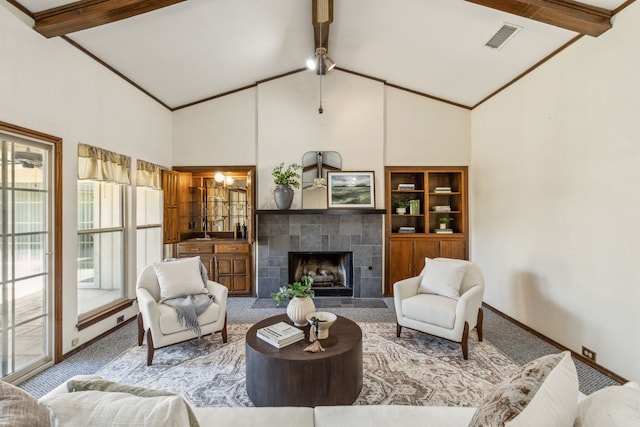 3109 Bullock Dr, Plano, TX 75023 - carpeted living room featuring beamed ceiling, a tile fireplace, high vaulted ceiling, and baseboards