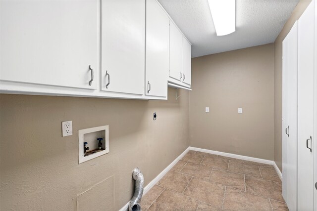 4201 Westchester Dr, Waco, TX 76710 - laundry room with cabinet space, hookup for an electric dryer, hookup for a washing machine, baseboards, and a textured ceiling