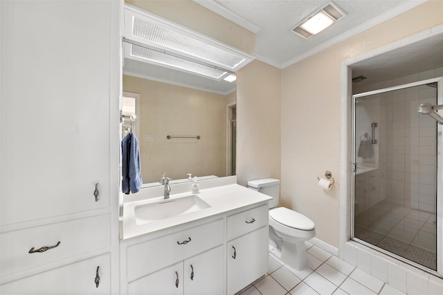4201 Westchester Dr, Waco, TX 76710 - full bath with ornamental molding, a shower stall, toilet, tile patterned flooring, and vanity