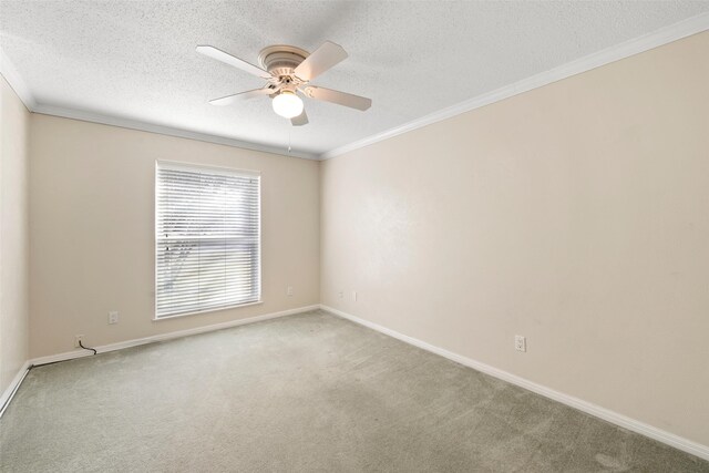 4201 Westchester Dr, Waco, TX 76710 - spare room featuring a textured ceiling, ceiling fan, ornamental molding, carpet flooring, and baseboards