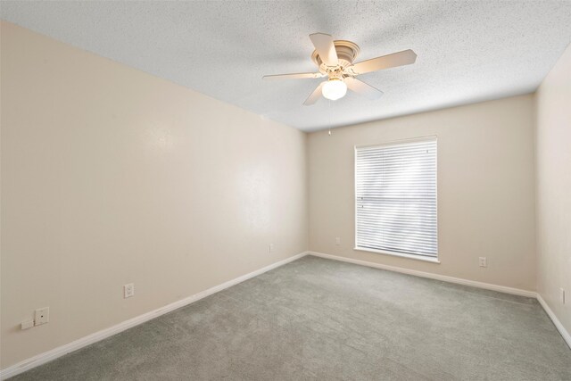4201 Westchester Dr, Waco, TX 76710 - carpeted empty room with a ceiling fan, baseboards, and a textured ceiling