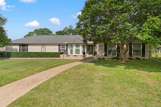 4201 Westchester Dr, Waco, TX 76710 - view of front of property with brick siding and a front yard