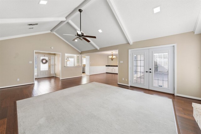 4201 Westchester Dr, Waco, TX 76710 - unfurnished living room with dark wood finished floors, a chandelier, beam ceiling, french doors, and ceiling fan