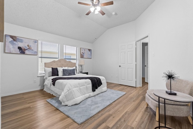 1132 Singletree Dr, Forney, TX 75126 - bedroom featuring lofted ceiling, wood finished floors, ceiling fan, baseboards, and a textured ceiling