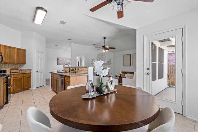 1132 Singletree Dr, Forney, TX 75126 - dining space featuring ceiling fan, light tile patterned floors, and a textured ceiling