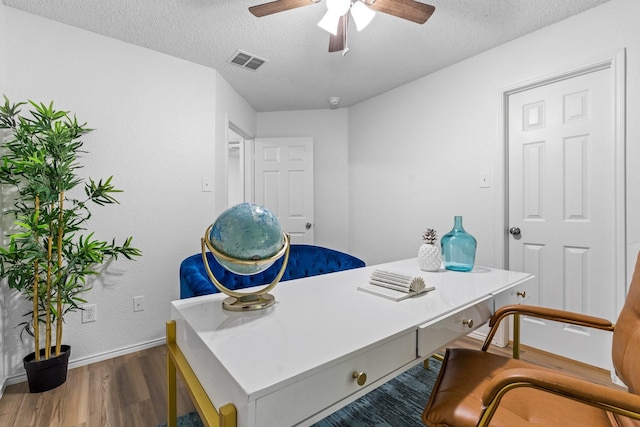 1132 Singletree Dr, Forney, TX 75126 - home office with dark wood-style flooring, a textured ceiling, baseboards, and ceiling fan