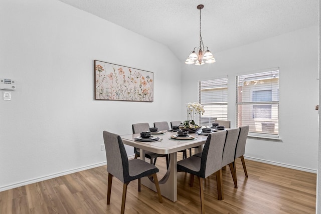 1132 Singletree Dr, Forney, TX 75126 - dining space with a chandelier, light wood-style floors, baseboards, and lofted ceiling