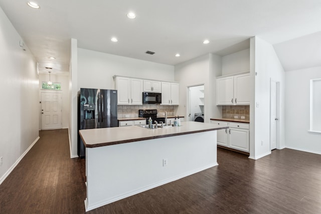 4033 Heavenly Way, Heartland, TX 75126 - kitchen featuring black appliances, dark wood-type flooring, a kitchen island with sink, white cabinetry, and recessed lighting