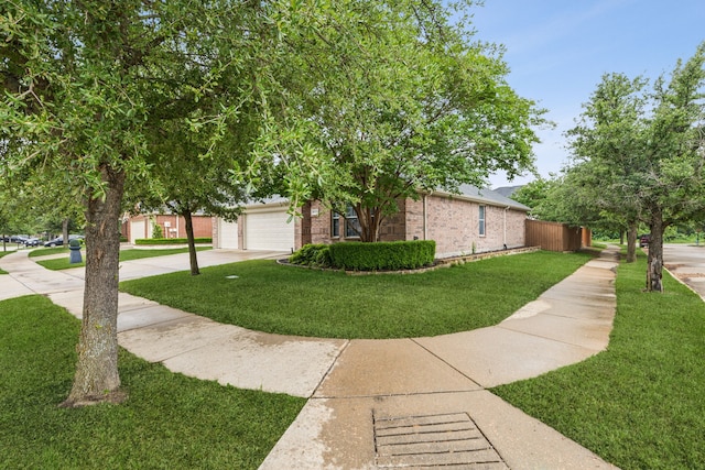 4033 Heavenly Way, Heartland, TX 75126 - view of side of home with brick siding, a yard, concrete driveway, and an attached garage