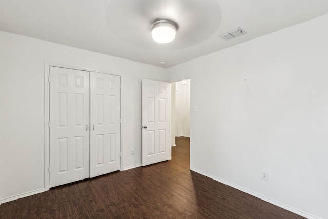 4033 Heavenly Way, Heartland, TX 75126 - unfurnished bedroom with wood finished floors, baseboards, a closet, and ceiling fan