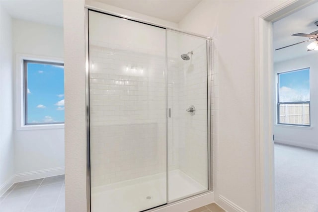2316 Glasgow Way, Denton, TX 76207 - full bath with a stall shower, baseboards, a ceiling fan, and plenty of natural light