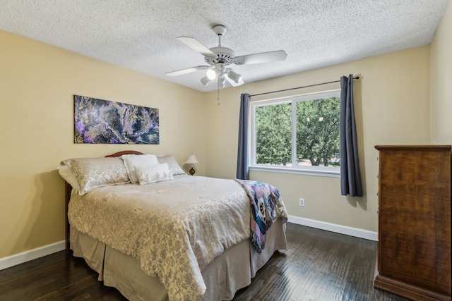 2902 Shady Lake Cir, Carrollton, TX 75006 - bedroom featuring baseboards, dark wood-style flooring, a ceiling fan, and a textured ceiling
