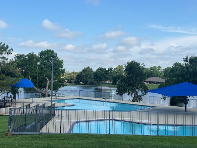 2902 Shady Lake Cir, Carrollton, TX 75006 - community pool featuring a patio area and view of scattered trees
